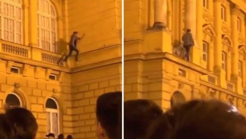 IGRA SA ŽIVOTOM: Mladić skakao po zgradi pozorišta (VIDEO)